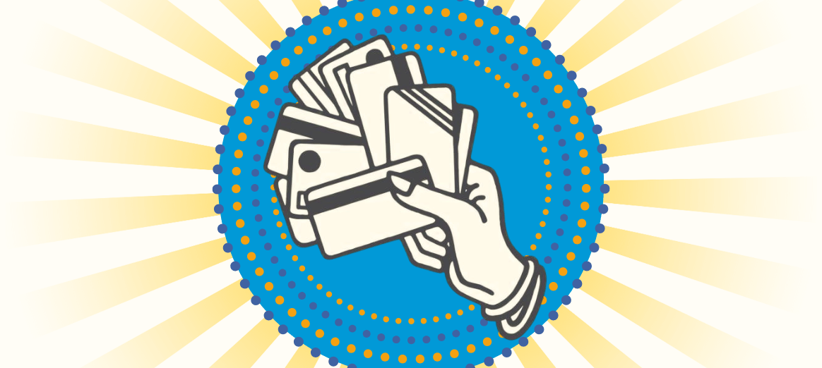 Image of hand holding lots of credit debit cards